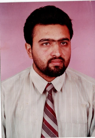 Archival formal portrait of Dr. D. K. Sharma, 1992